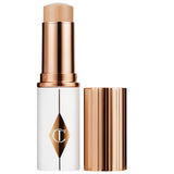 *PREORDEN: Unreal Skin Sheer Glow Tint Hydrating Foundation Stick - Charlotte Tilbury / Base en barra de cobertura ligera